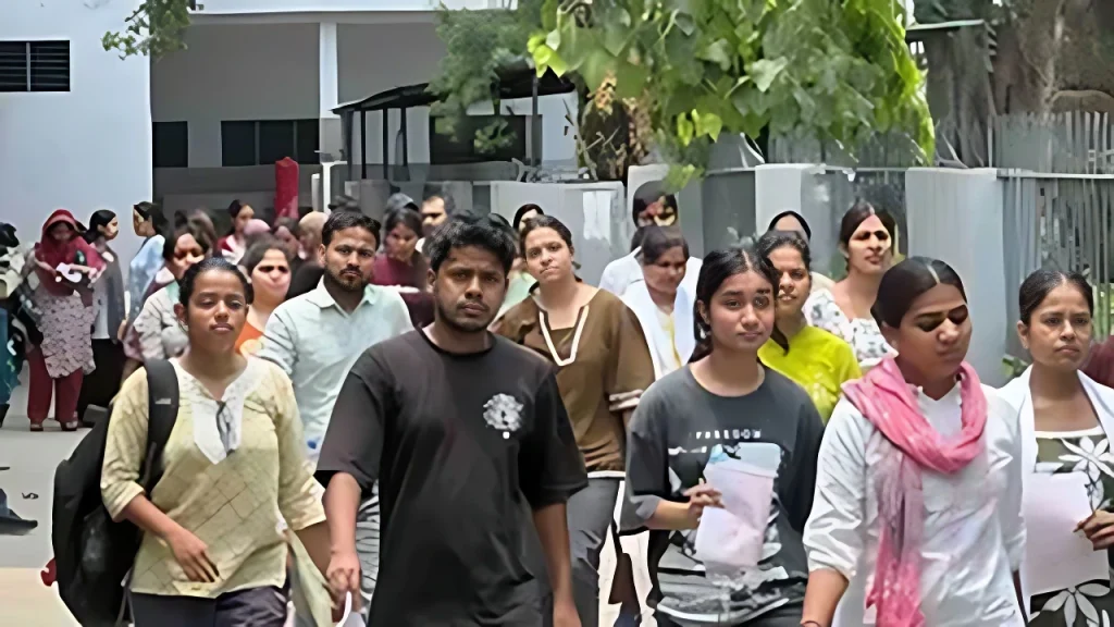 Diverse group of people walking together down a city street, some carrying documents and backpacks.