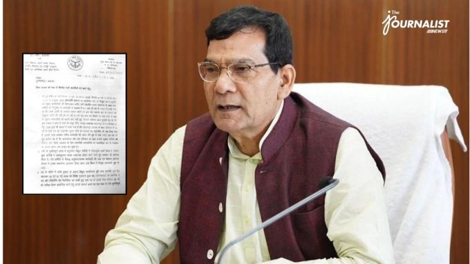 Man in a beige shirt and maroon vest, wearing glasses, sits at a desk with a microphone; a document inset appears on the left.