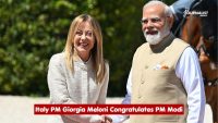 Italian Prime Minister Giorgia Meloni and Indian Prime Minister Narendra Modi shake hands outdoors during a formal greeting.