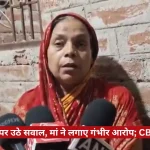 Woman in a red headscarf being interviewed by multiple reporters against a brick wall, with 'The Journalist News' logo visible and a Hindi news ticker about police encounter and CBI inquiry in the frame.