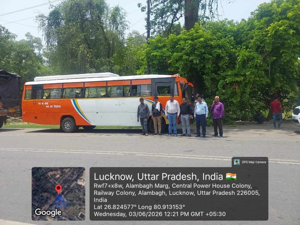 Orange-and-white bus parked on a street with a group of men standing beside it; GPS/location watermark at the bottom of the image.