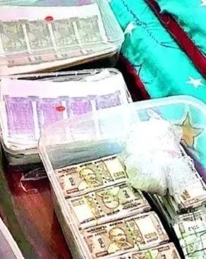 Stacks of banknotes in plastic-wrapped bundles inside a cooler, with a turquoise bag nearby.