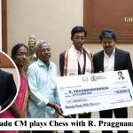 Tamil Nadu CM and R. Praggnanandhaa posing with a large cheque at a ceremony.