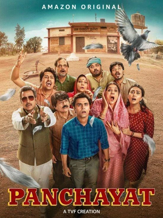 Poster for the TV series Panchayat: a group of villagers in a rural setting gaze upward as pigeons fly around a small village building behind them; bold red Panchayat title at bottom.