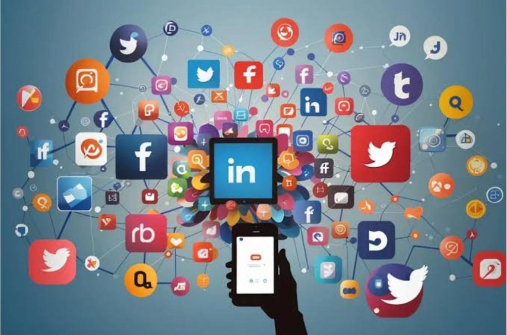Person holding a smartphone with a splash of colorful social media icons surrounding it, symbolizing connectivity.