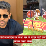 Man wearing dark sunglasses sits indoors beside a cricket-themed birthday cake in a news image about MS Dhoni's 45th birthday and fans outside his house.