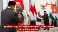 Indonesian official pins a medal on Indian Prime Minister Narendra Modi during a formal ceremony, with Indonesian and Indian flags in the background and a crest on the wall behind them.