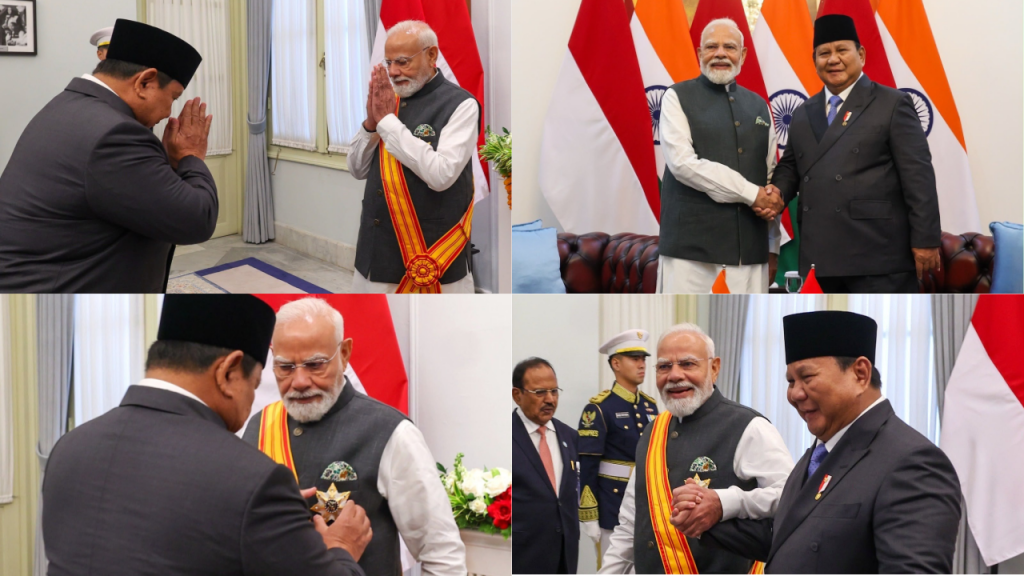 Formal ceremony: a man in a dark suit bows with folded hands to Indian PM Narendra Modi, who wears a sash in a bright room.
