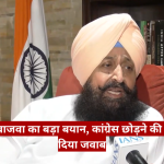 Sikh man in a peach turban and white kurta being interviewed, with an Indian flag and bookshelf in the background and a red Hindi news ticker across the bottom.