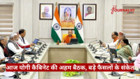 Official government meeting with Prime Minister Modi at the head of a U-shaped conference table, Indian flags and portraits in the background.