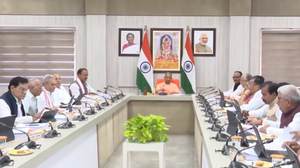 Light Blue and Yellow Bold Month Astrology Horoscope YouTube Thumbnail 6 - The Journalist News Prime Minister Narendra Modi chairs a formal meeting at a long conference table with officials on both sides, Indian flags and portraits on the wall behind him.