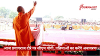 Speaker in orange robes at a podium addressing a large outdoor crowd; Journalist News logo in the corner.