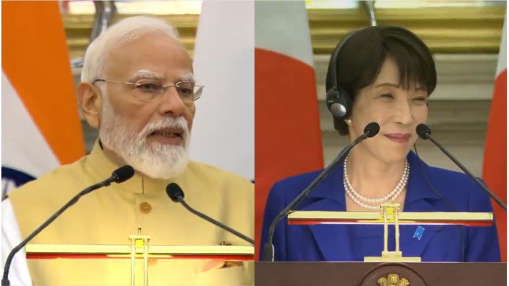 Modi and a woman official speak at a bilateral press conference, each at a podium with microphones and flags in the background.